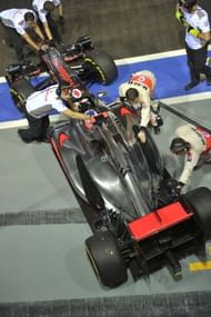 McLaren-Mercedes' British driver Jenson Button's formula one race car rolls in for a pit stop